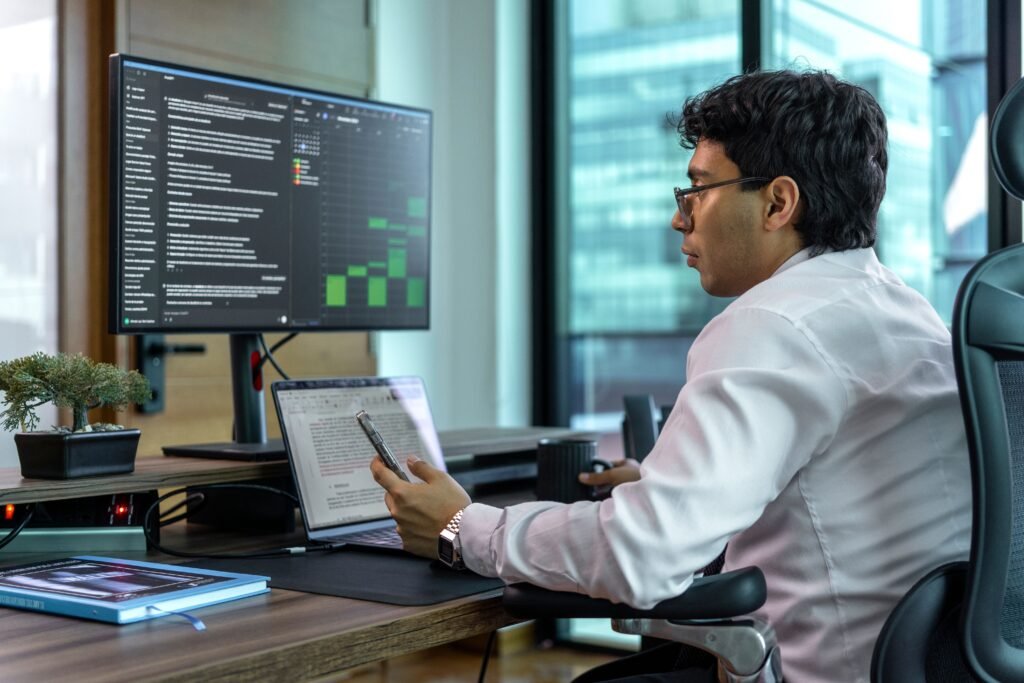 Accountant reviewing VAT figures on screen in a modern office — TaxDigit VAT services, Guildford