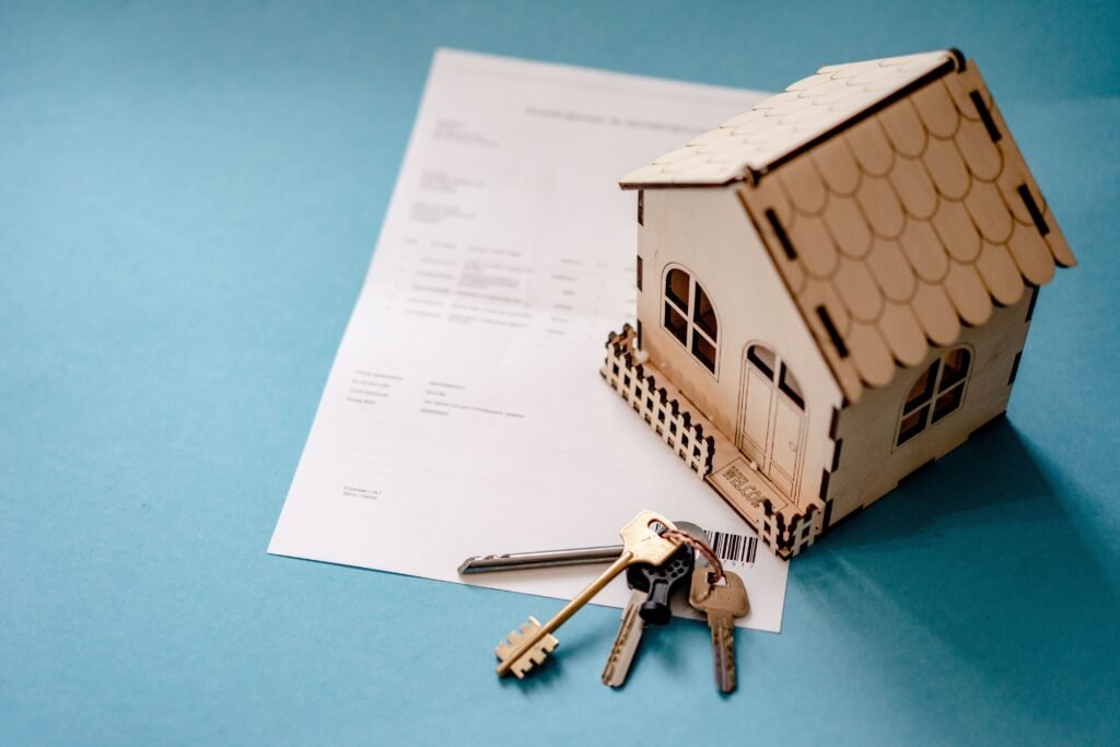 House model, key and document for property Capital Gains Tax planning — CGT advisers, Guildford & Surrey