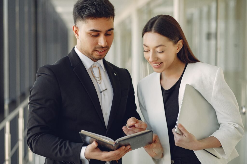 TaxDigit accountant reviewing company figures with a director — Corporation Tax advice in Guildford