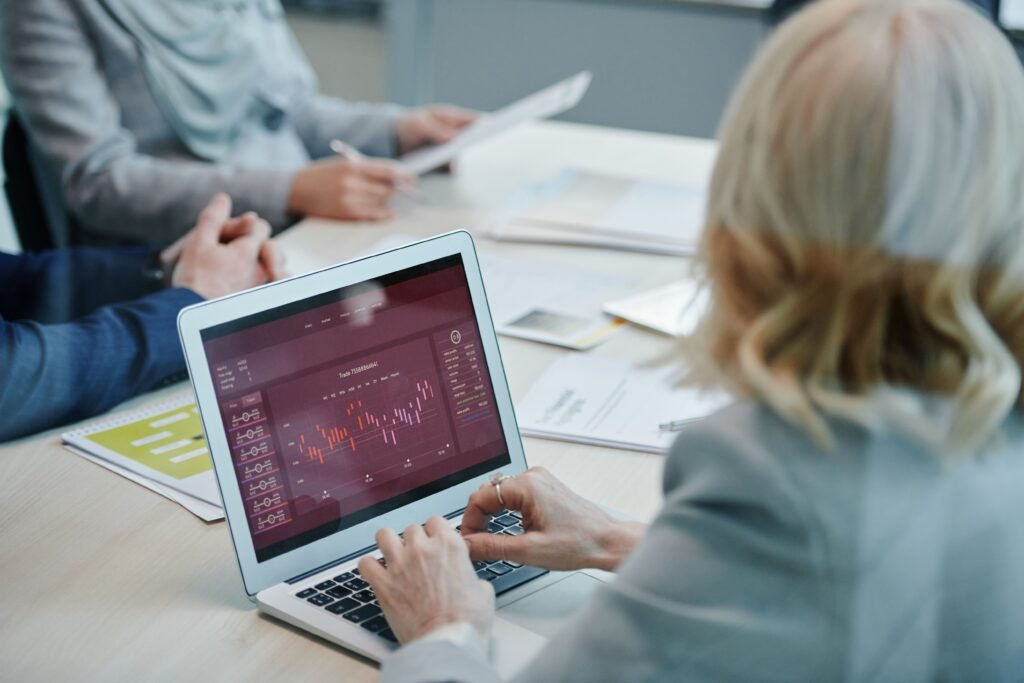 Adviser and client reviewing investment statements — TaxDigit Capital Gains Tax advice, Guildford