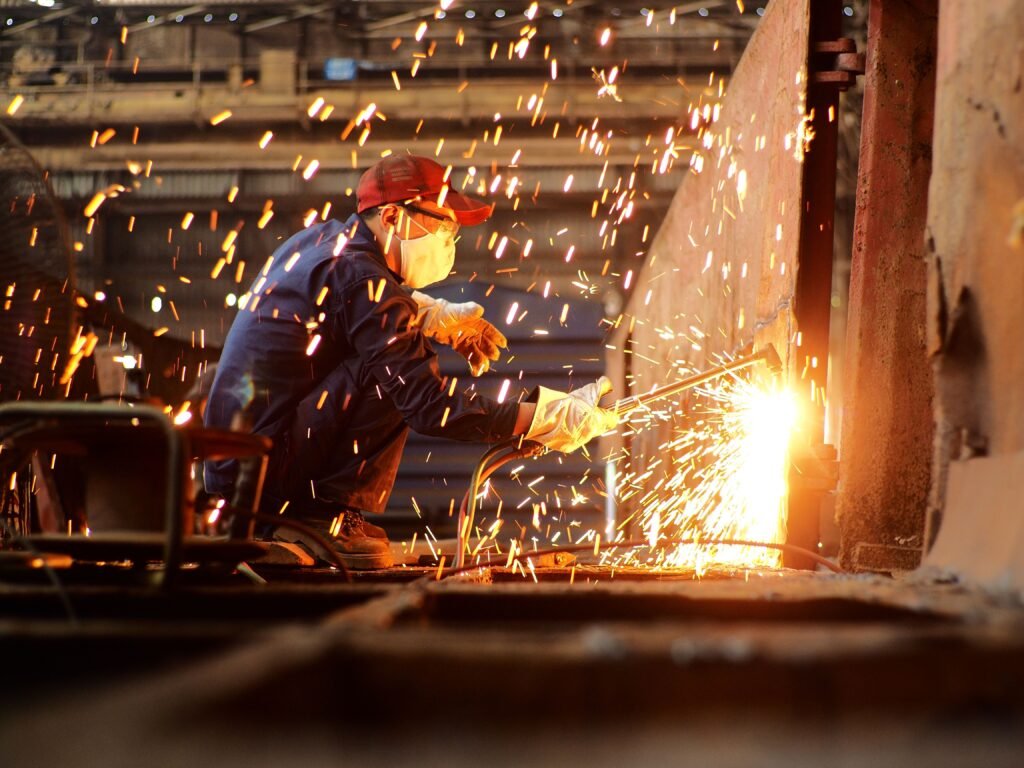 Welder at work in an engineering workshop — accountants for manufacturers and engineering businesses, Surrey & UK