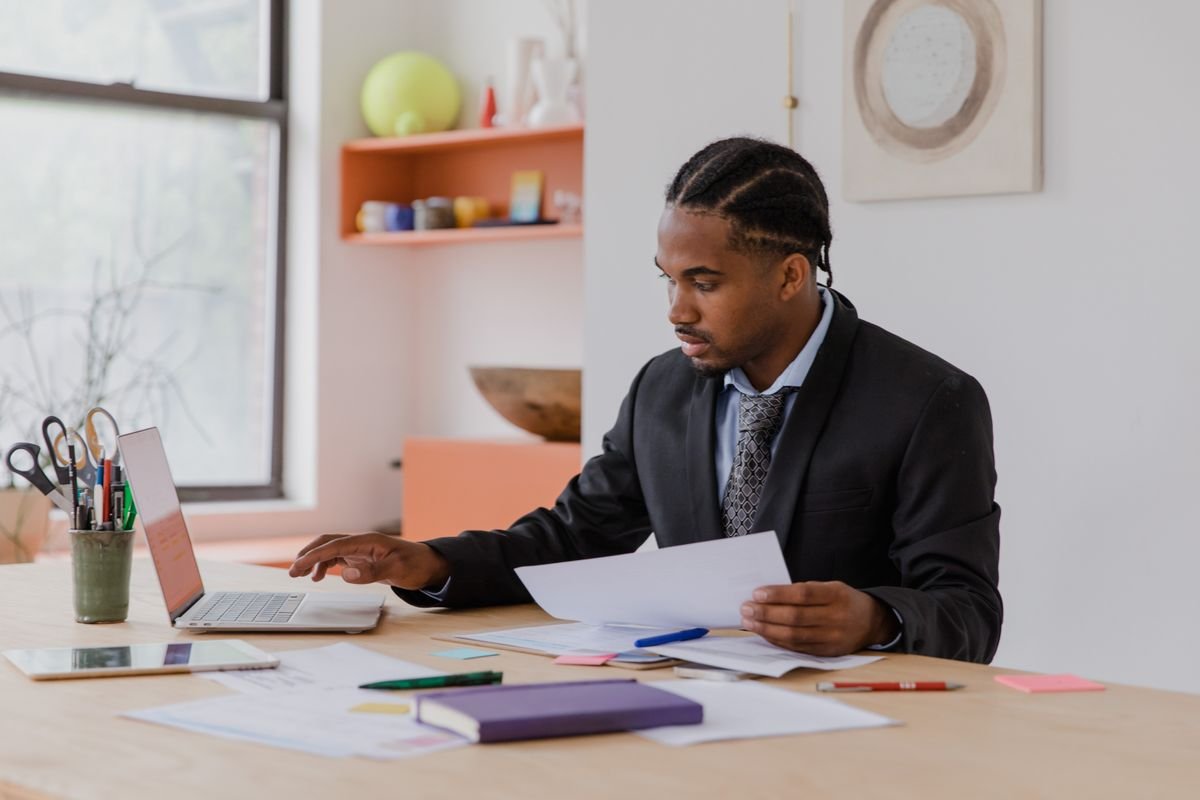 Business owner reviewing Self Assessment paperwork at a desk — accountants in Surrey, TaxDigit