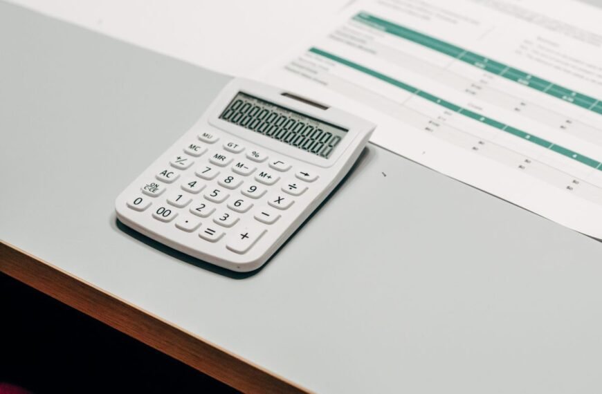 Calculator beside a financial spreadsheet, representing TaxDigit free tax tools