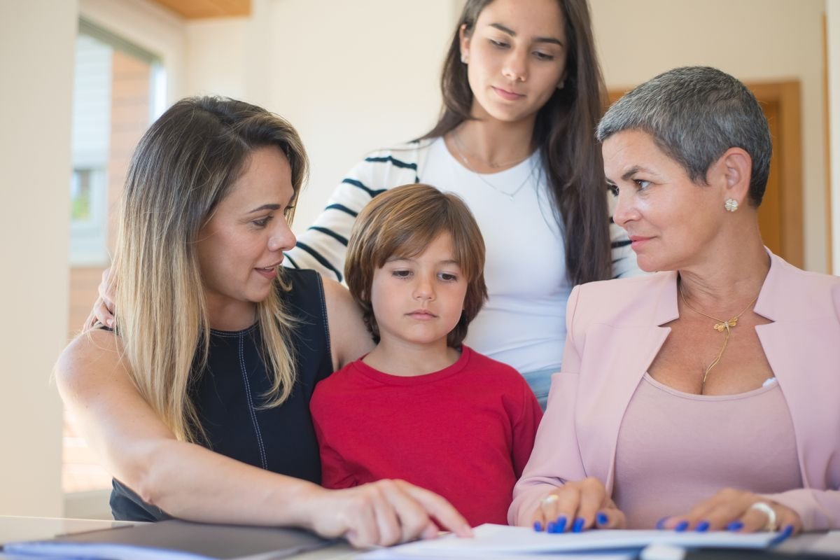 A family reviewing documents with an adviser, representing executors administering a crypto estate