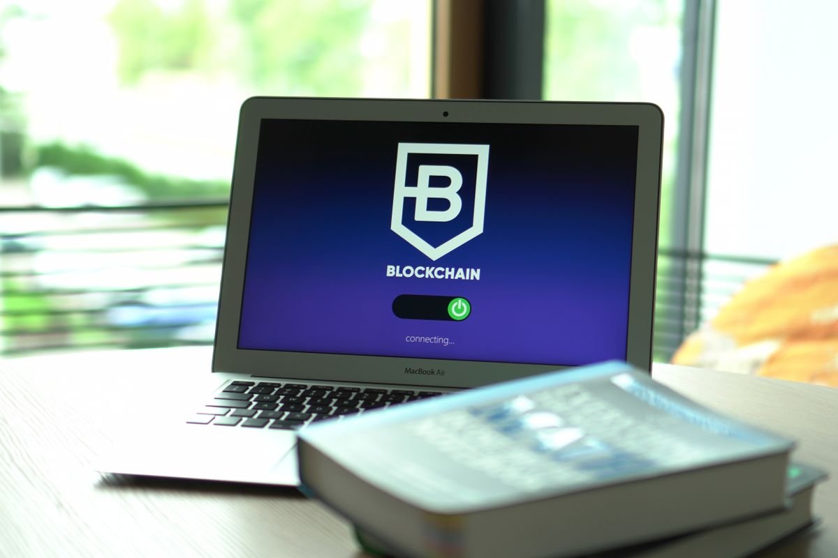 A laptop showing a blockchain interface, representing crypto tax software connecting exchanges and wallets