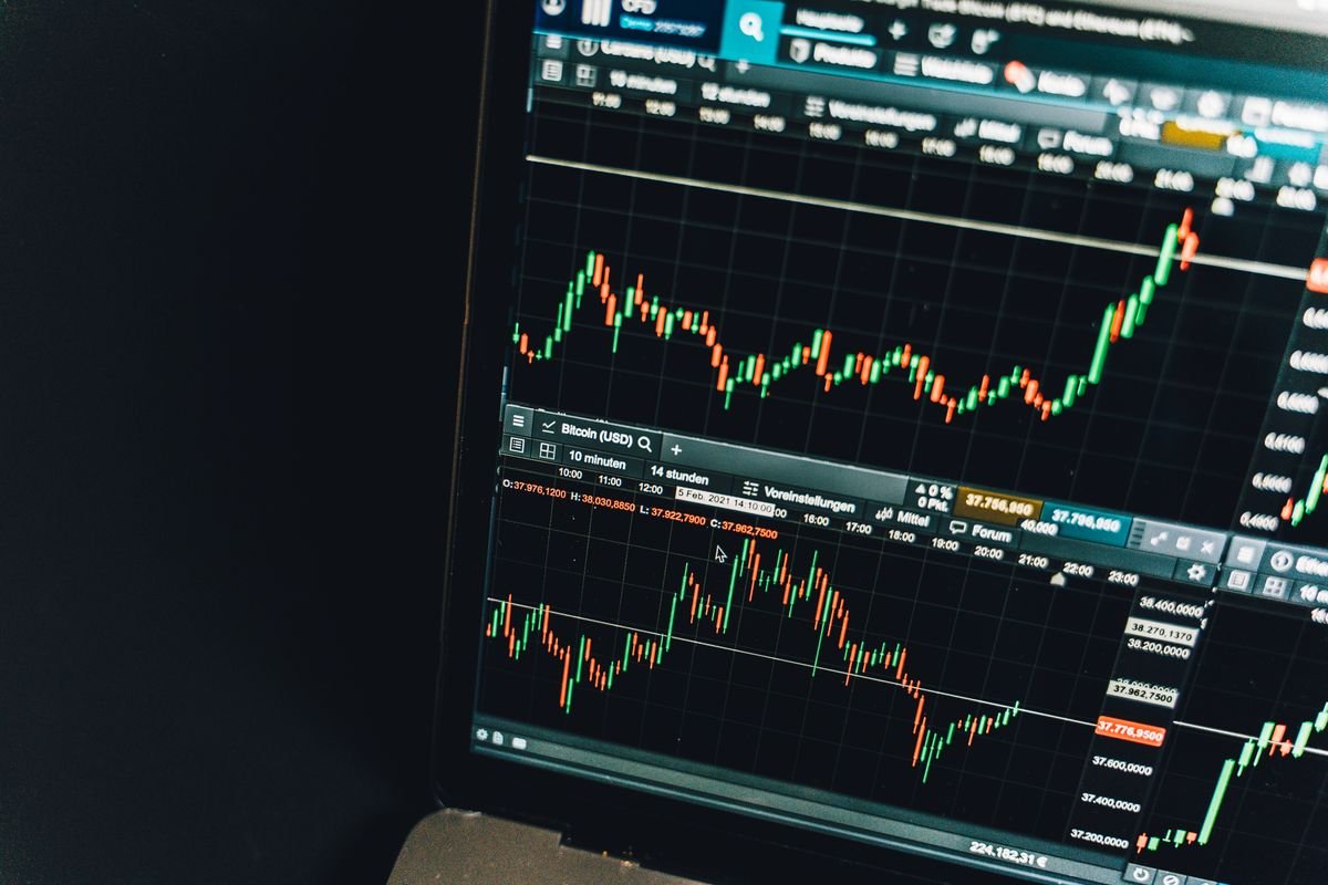 A live cryptocurrency trading chart on screen, representing UK tax on crypto trading, margin and derivatives