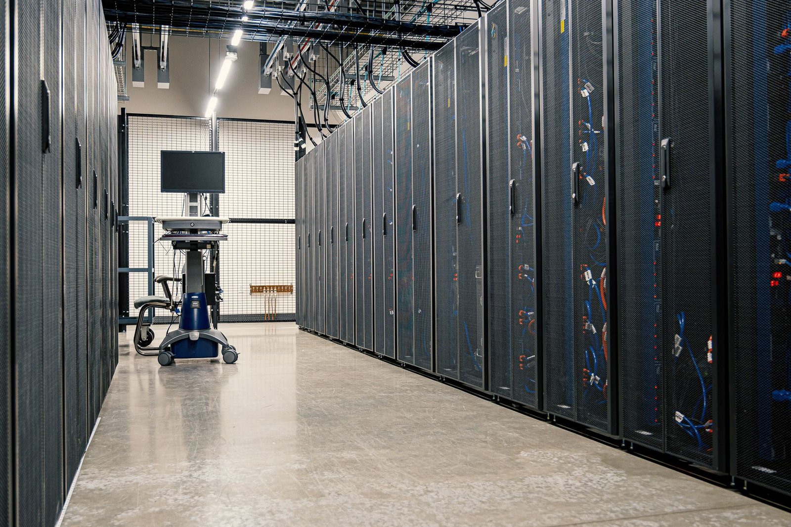Rows of equipment cabinets in a data centre, representing commercial cryptocurrency mining