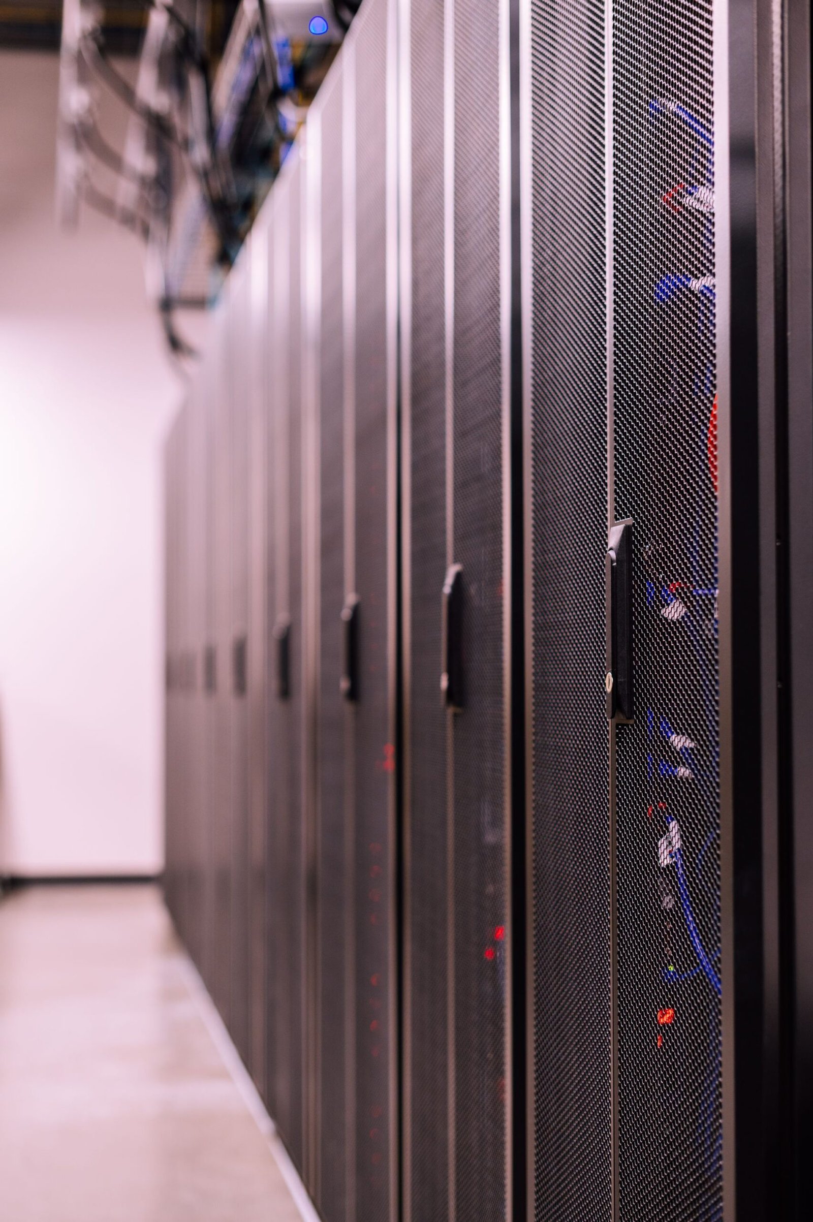 Fibre-optic cabling across server cabinets in a mining facility