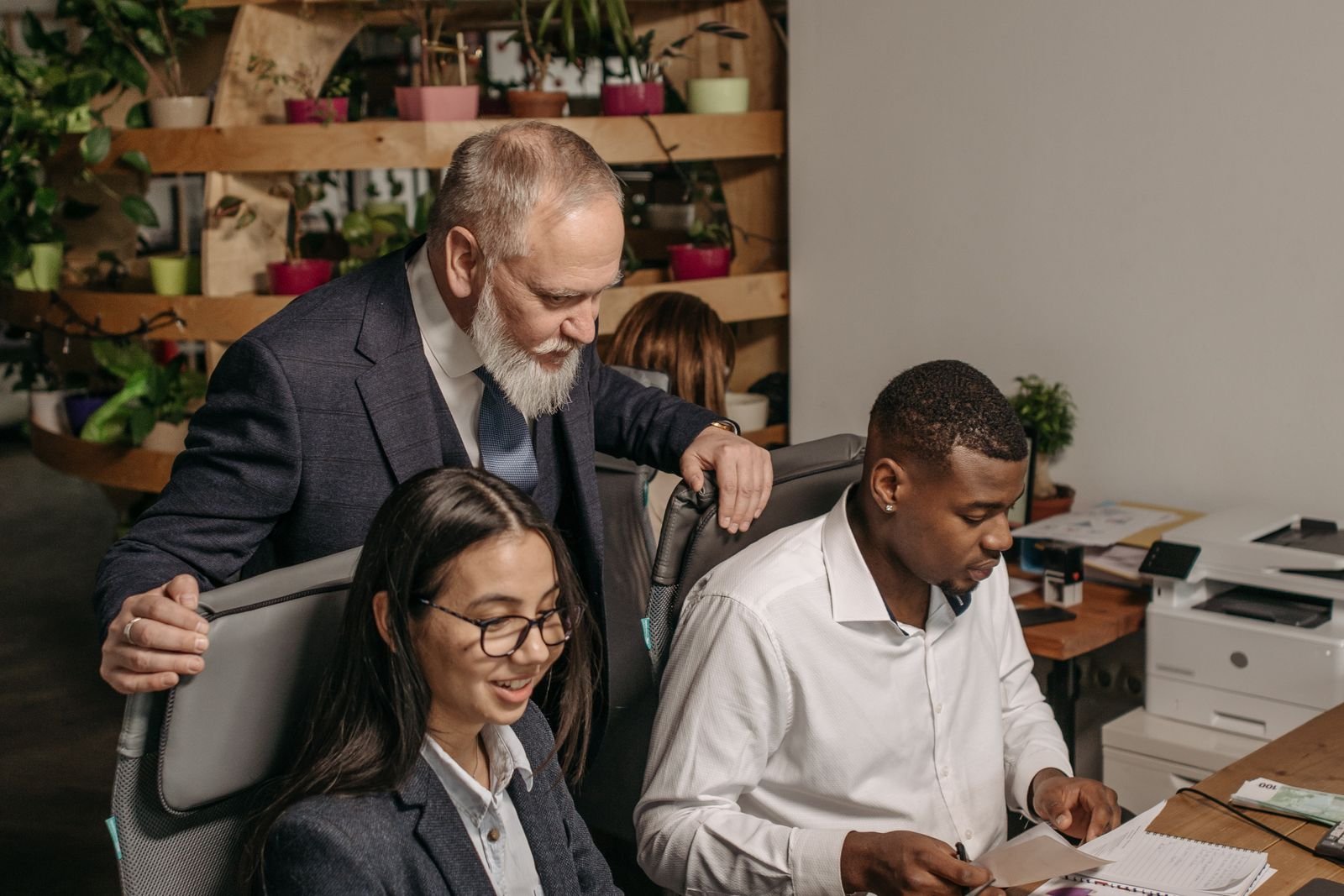 Accountancy team reviewing client paperwork in an office
