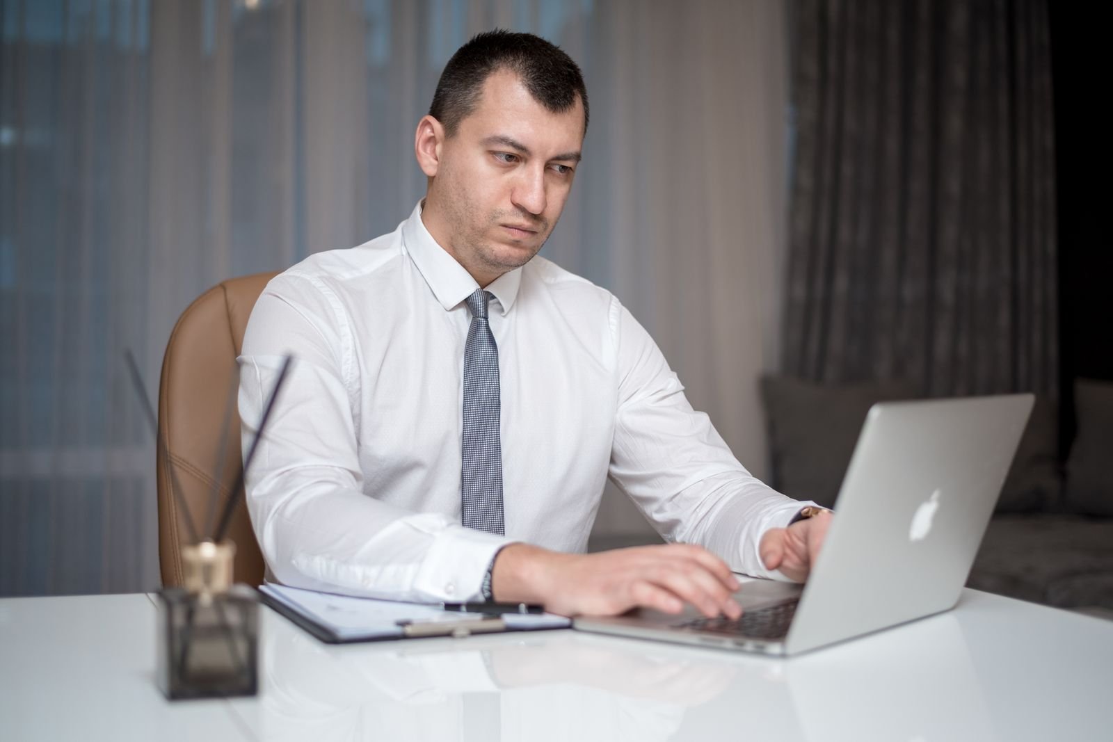 Business owner working at a laptop in an office