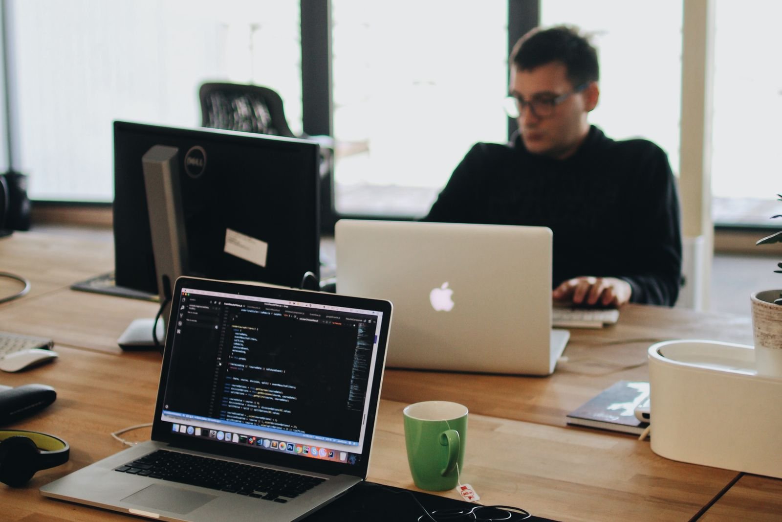 Technology team working at laptops in an office — TaxDigit, best Indian accountant in the UK
