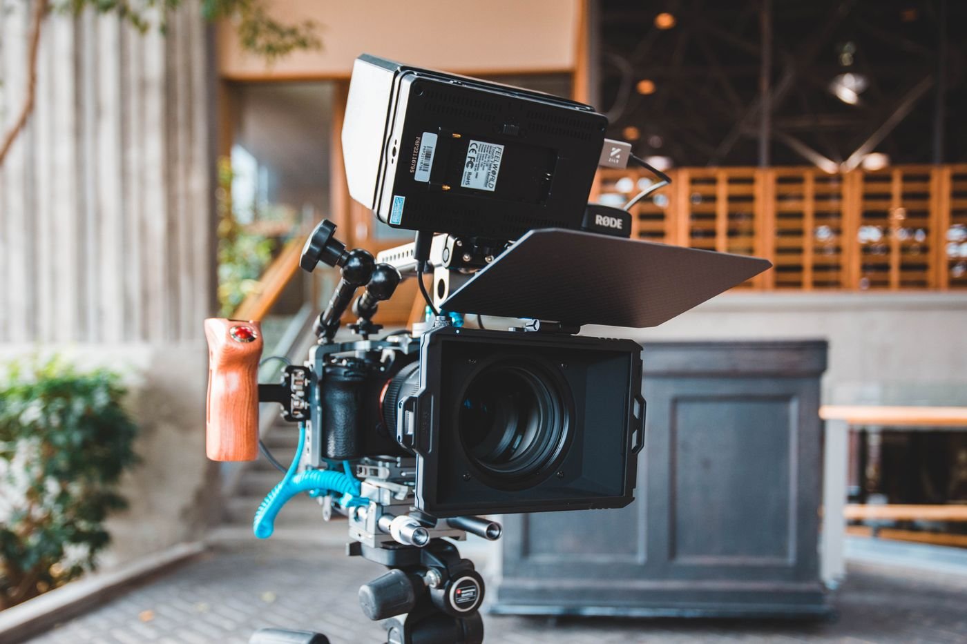 Professional film camera and lighting equipment set up on a television production stage