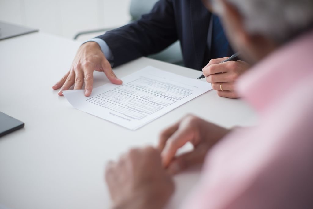 Company directors signing UK registration documents with their accountant