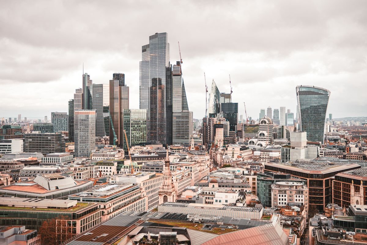 An aerial view of the London skyline, representing the UK statutory residence test and temporary non-residence
